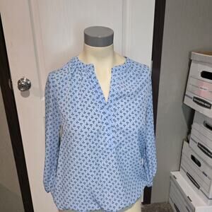 Blue blouse top with black anchors on it